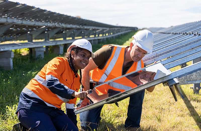  Workers installing solar panels